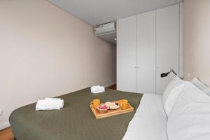 Rooftop Pools & Balcony Haven by HostWise