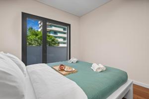 Rooftop Pools & Balcony Haven by HostWise