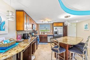 Surfside 112 - Ground-Level with Ocean View Patio, Steps to Pool & Beach