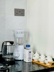 Comfort living two bedroom apartment with fully equipped gym swimming pool private parking space ,child play area and amazing scenic views