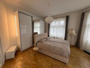 A stylish and comfortable 2 bedroom apartment with thoughtful design, private balcony, and a relaxing bathtub, making it perfect for well being and cozy city living