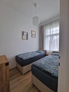 A stylish and comfortable 2 bedroom apartment with thoughtful design, private balcony, and a relaxing bathtub, making it perfect for well being and cozy city living