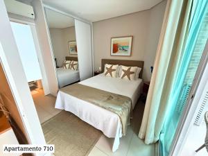 Book Santos Mar, Sol e Conforto no Unique 710 e 810