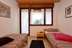 Apartments by the sea Petrcane, Zadar - 24879