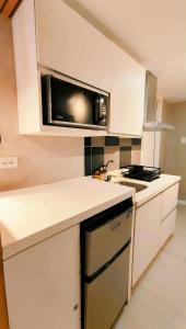 Modern Elegance Escape in Azure North Bali Tower near Malls, Airport and NLEX