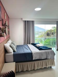 Casa 396 Angra Dos Reis Vista para o Mar, Wi-Fi, Ar, 15min do centro da cidade e Perto da Praia do Pontal ideal para grupos que vai de família, amigos ou casal, estacionamento no local privado