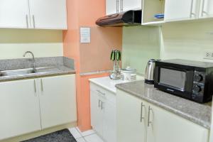 Modern Spacious 2BR Condo with Wifi at Aurora Gardens San Juan City near Rob Magnolia