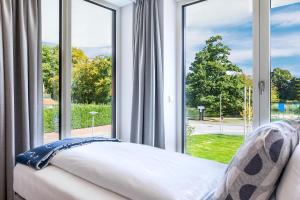 Deluxe-Suite 1-02 mit Ost-Loggia und schönem Gartenblick