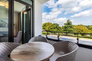 Deluxe-Apartment 2-10 mit Balkon und schönem Gartenblick