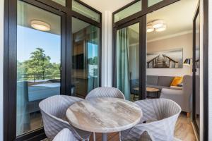 Godewindpark Deluxe-Apartment 2-12 mit eigener e-Ladesäule in der Tiefgarage und XL-Strandkorb am Strand