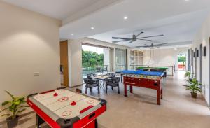 SaffronStays Grand Odyssy - 4BR luxury pool villa with sauna, game zone & lawn, perfect for weddings & parties in Karjat