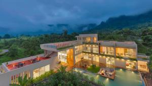 SaffronStays Grand Odyssy - 4BR luxury pool villa with sauna, game zone & lawn, perfect for weddings & parties in Karjat