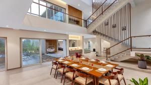 SaffronStays Grand Odyssy - 4BR luxury pool villa with sauna, game zone & lawn, perfect for weddings & parties in Karjat