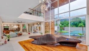 SaffronStays Grand Odyssy - 4BR luxury pool villa with sauna, game zone & lawn, perfect for weddings & parties in Karjat