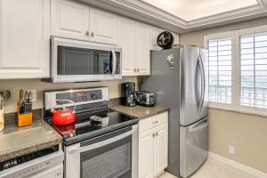 Walk to Turtle Beach! Bayfront Unit with Pool and Dock