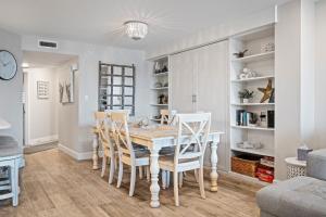 Stunning direct oceanfront condo with a balcony, hot tub, and heated pool