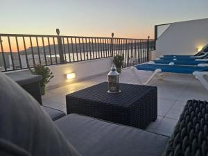 Bright Coastal Penthouse with Huge Terrace Overlooking the Sea- Ghadira Mellieha