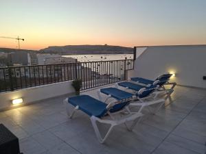 Bright Coastal Penthouse with Huge Terrace Overlooking the Sea- Ghadira Mellieha