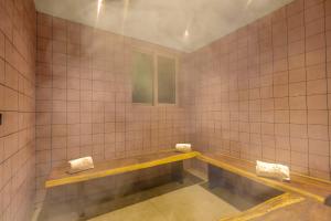 SaffronStays Grand Odyssy - 4BR luxury pool villa with sauna, game zone & lawn, perfect for weddings & parties in Karjat