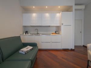 Bright & Chic 1BDR with shared rooftop terrace in San Babila