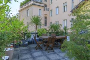 Bright & Chic 1BDR with shared rooftop terrace in San Babila