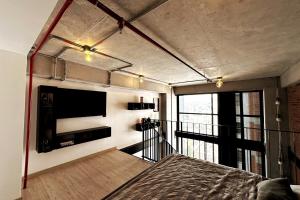 Central Medellin Modern Loft - Balcony and Transit