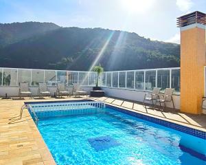 Apartamentos a 100m Praia das Toninhas PISCINA AQUECIDA