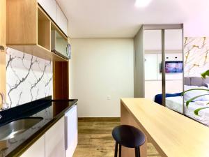 Studio aconchegante com piscina a 350m da praia