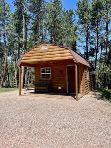 Unique Wooden Cabin Nestled Amidst Trees in Rapid City, South Dakota