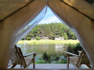 Romantic Safari Tent Surrounded by Trees Next to the Lake for a Unique Glamping Getaway in Lake Ariel, Pennsylvania