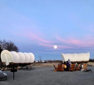 Perfect Glamping Vacations in this Rustic Conestoga Covered Wagon Rental in Oklahoma