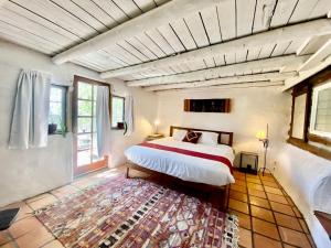 Log Casita Overlooking Pond and Waterfall near Taos, New Mexico