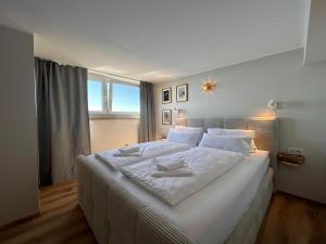 Appartement WOLKE7 byTILLY - Familienfreundliches Alpenzuhause mit Hallenbad, Balkon & Panoramablick hoch oben auf der Gerlitzen