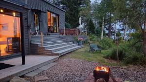 The lake house - boats, beach, sauna, dock and barbecue!