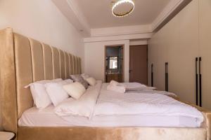 modern executive three bedroom apartment which features a swimming pool, state of the art fully equipped gym andmodern unmatched luxurious facilities which offfers luxury lifestyle