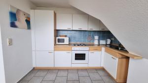 Ferienwohnung "Achtern Diek 4" 1 Reihe an der Ostseeküste