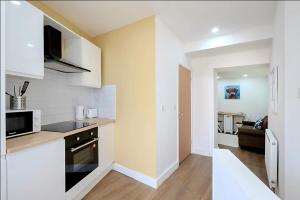 Modern Comforts – 4 Bedroom Home for Work & Play