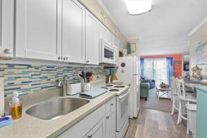 Oceanside Condo w Pool Steps to Beach