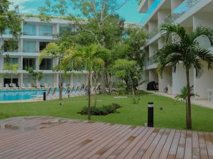 Stylish Playacar Condo with Balcony & Pool