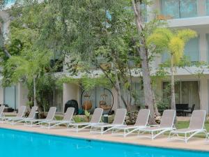 Stylish Playacar Condo with Balcony & Pool