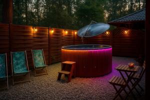 Dom Zielarki z widokiem na jezioro, sauna, balia