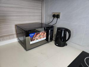 Kileleshwa Two Bedroom Dining Suite with Skyroof Gym & Balcony