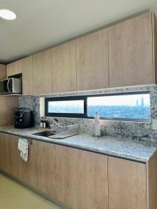 Beautiful apartment on the 19th floor, in front of the new Consulate!