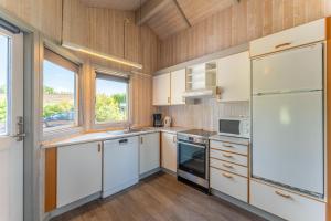4 Personen Ferienhaus mit Kaminofen, Kanu und herrlichem Seeblick in Otterndorf