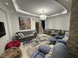 New Cairo Shared Apartment with the landlord close to airport garden view for males only or married couple because of the Egyptian Culture