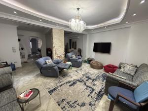 New Cairo Shared Apartment with the landlord close to airport garden view for males only or married couple because of the Egyptian Culture