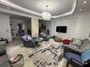 New Cairo Shared Apartment with the landlord close to airport garden view for males only or married couple because of the Egyptian Culture