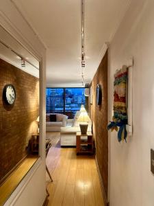 Spacious 1 bedroom apartment with sofa bed steps from Costanera Center and MUT, between Metro El Golf and Tobalaba Free parking