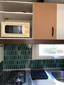 Chalet familial style Bali dans camping avec piscine