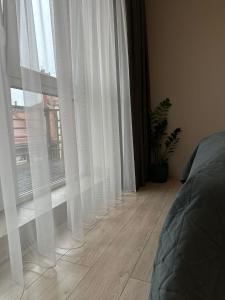 DHARMA Stay APARTAMENTAI su terasa ir vaizdu į miestą Self check-in